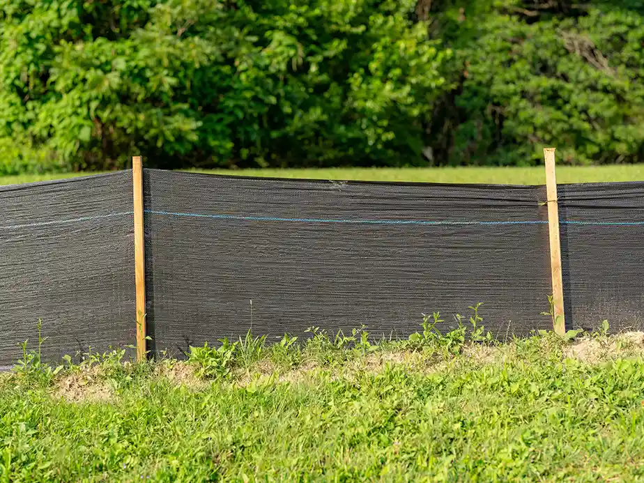 Silt fence installed along a construction site perimeter